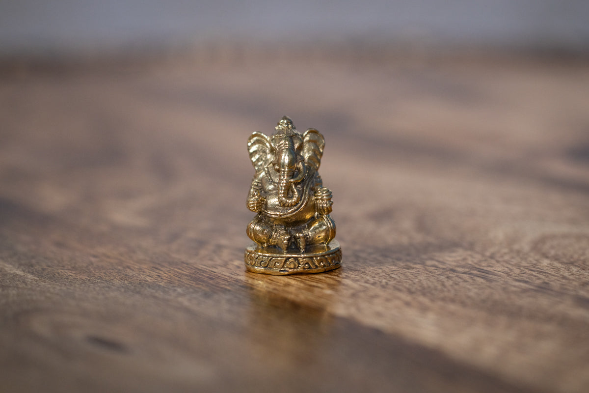 Lord Ganesha with a modak - mini murti