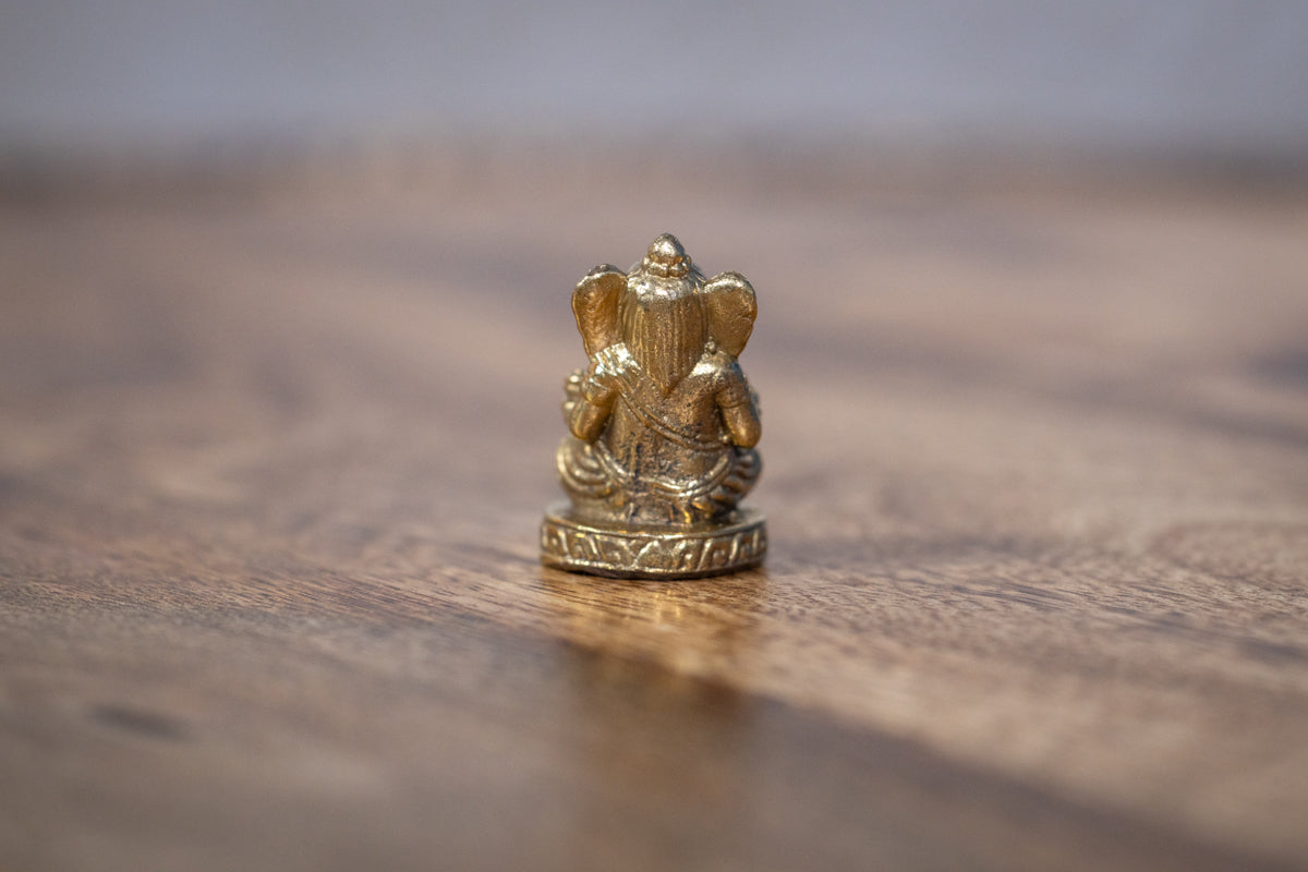 Lord Ganesha with a modak - mini murti
